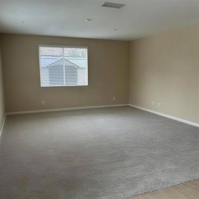 Beige carpet installed wall to wall in a Sacramento bedroom